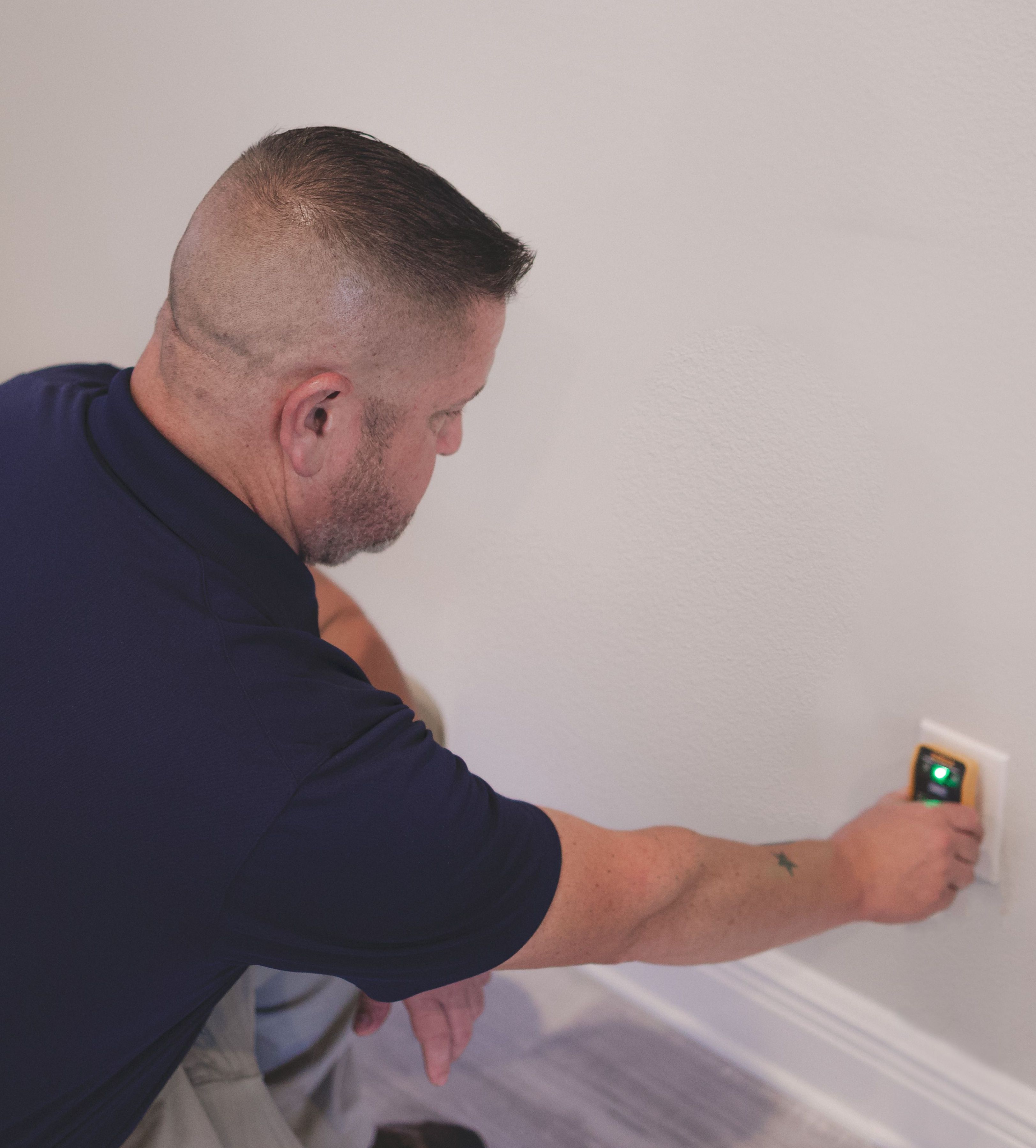 WIN Home Inspector checking the water tap in the kitchen