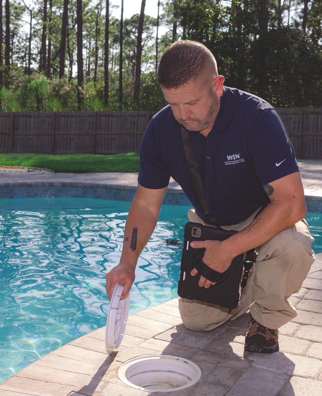 WIN Home Inspector inspecting the pool area