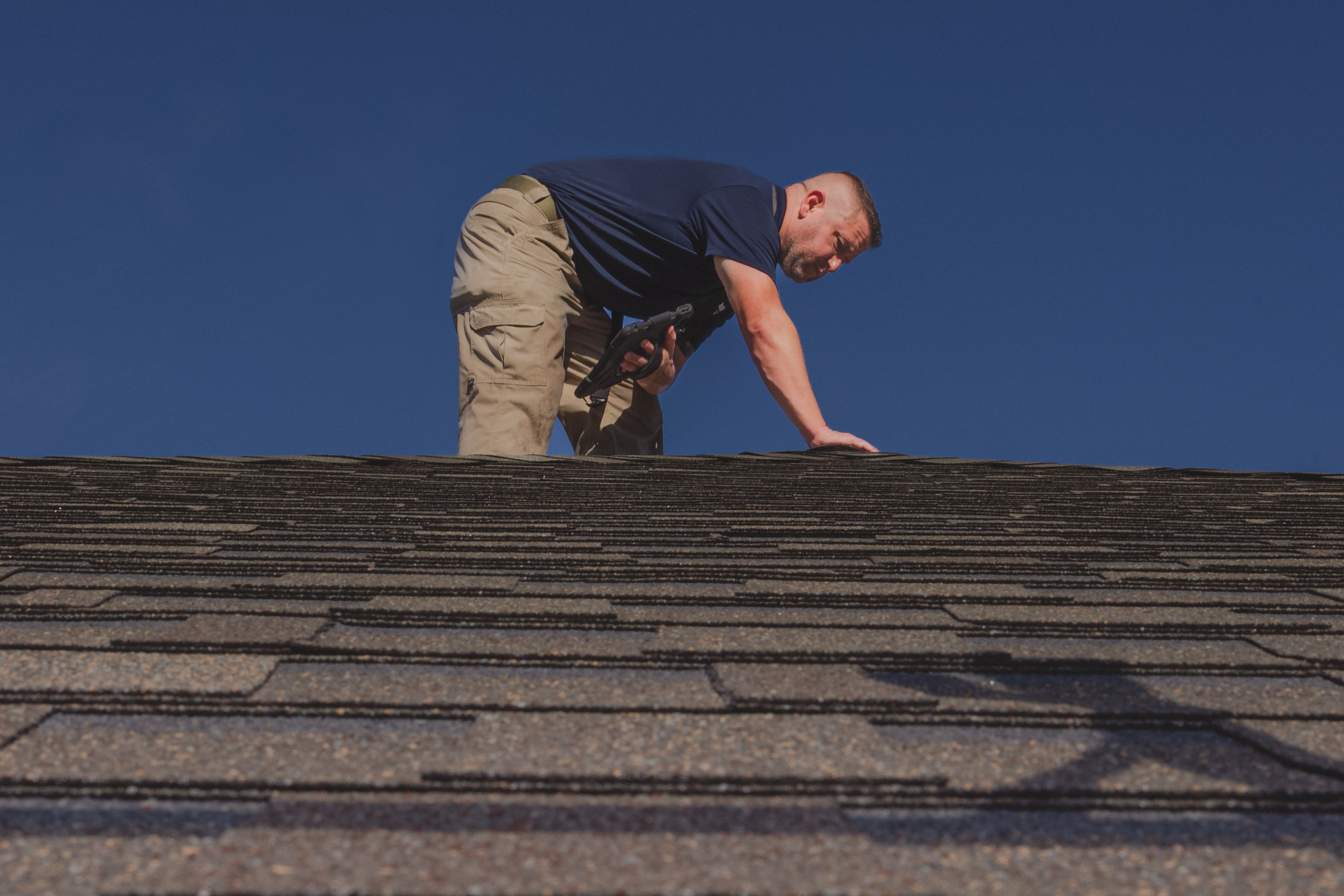 WIN Home Inspector doing a roof inspection