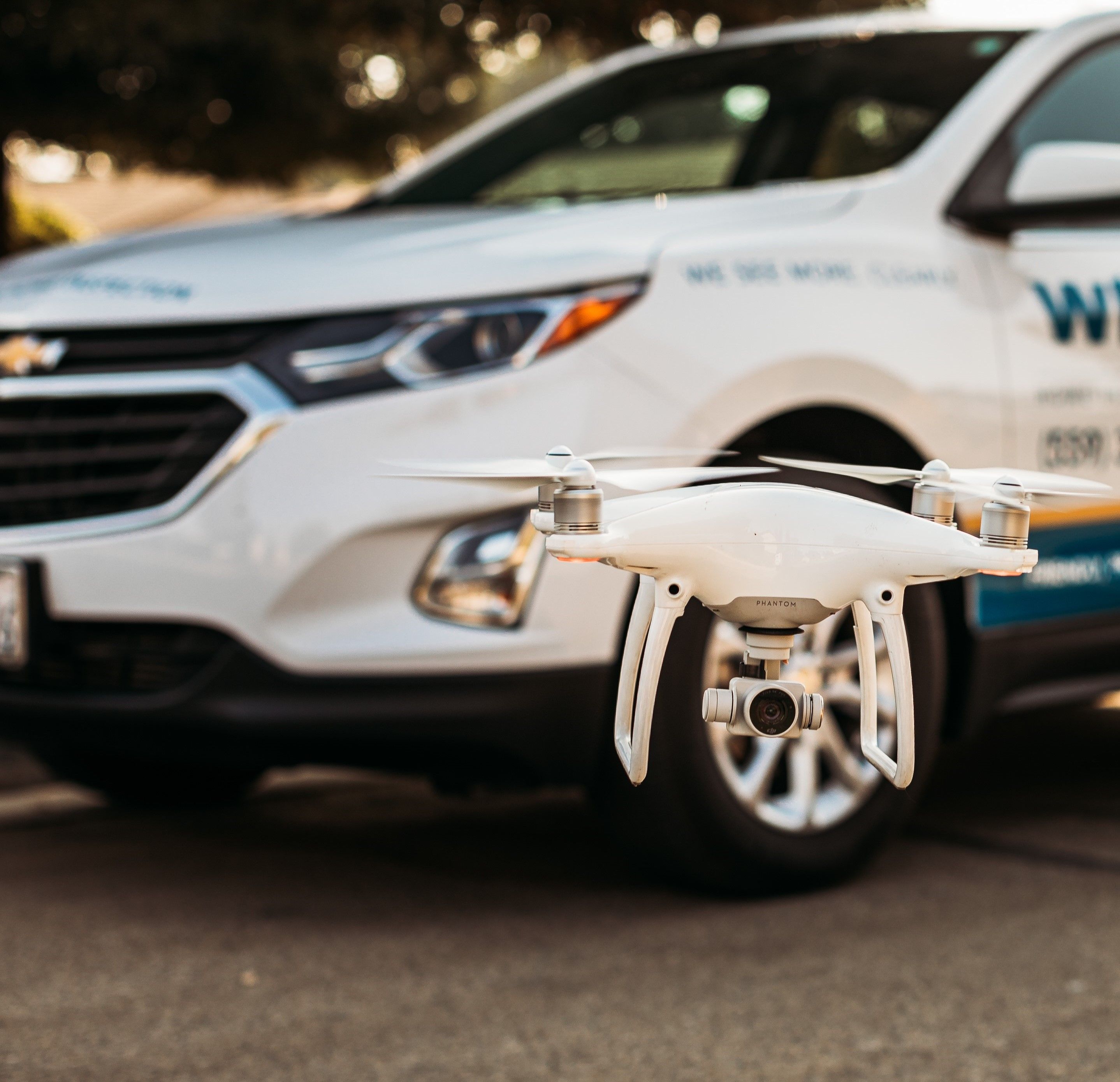 Drone in front of WIN Home Inspector's Car