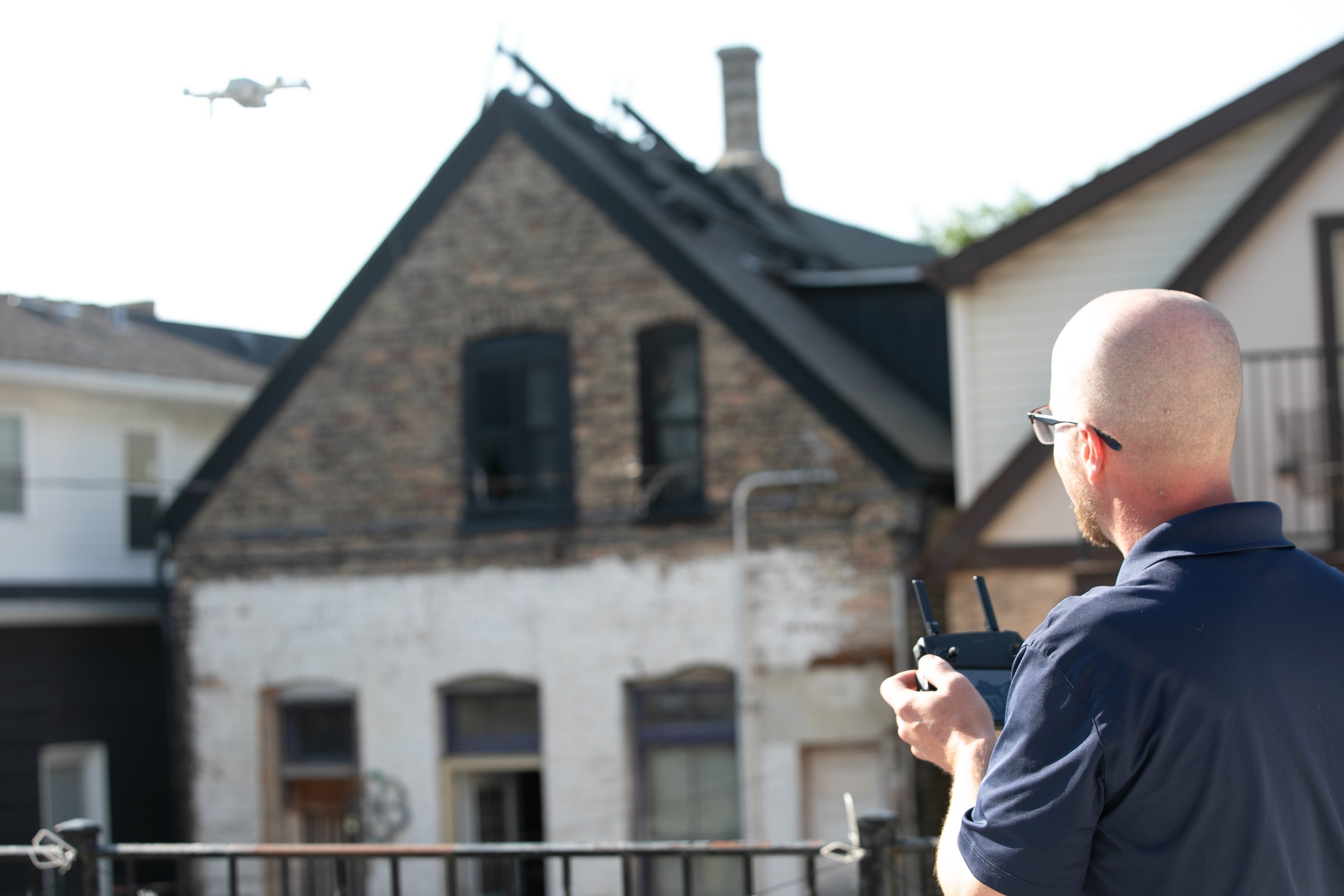 WIN Home Inspector doing a drone inspection of a house