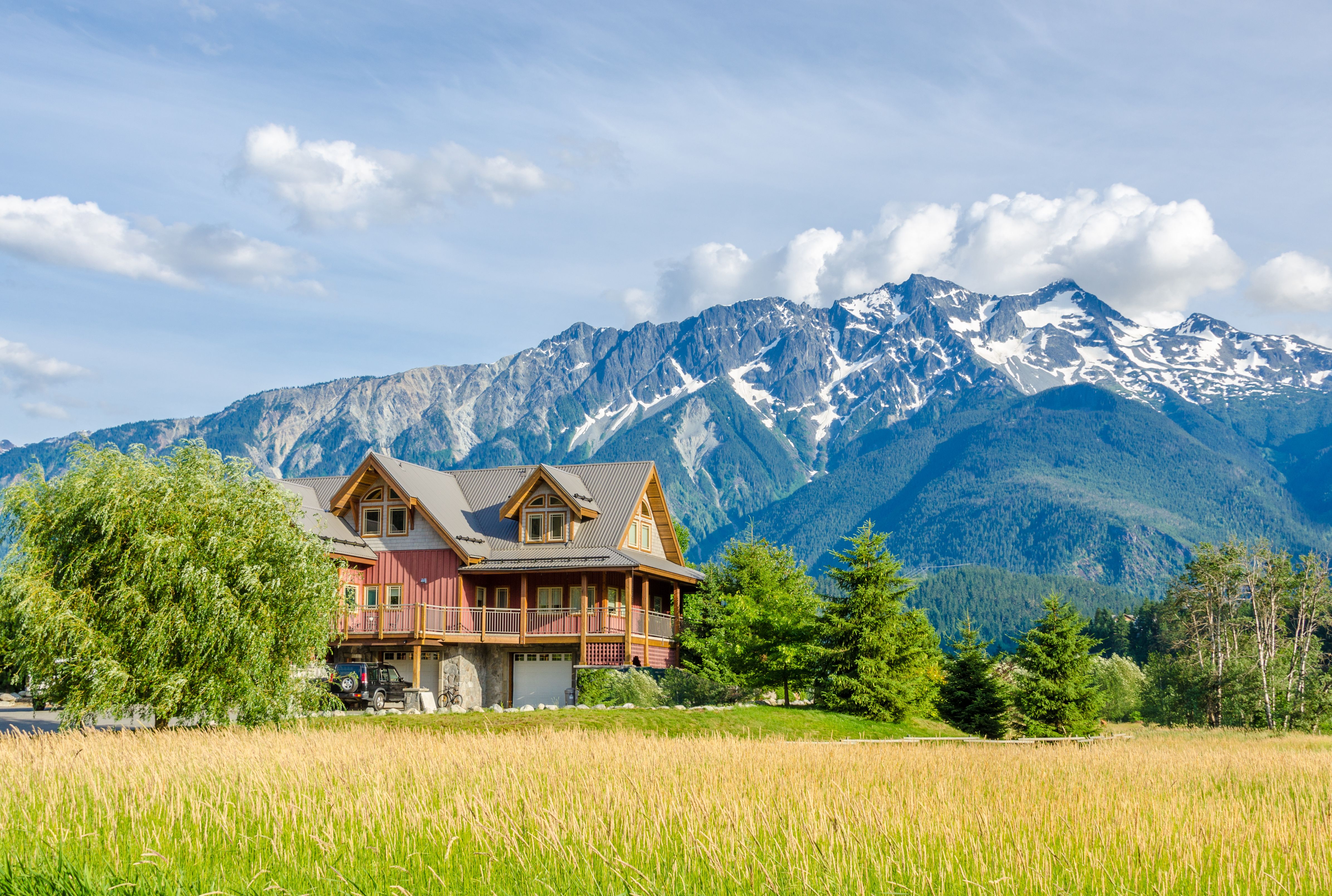 A beautiful house with a lawn and a walkway