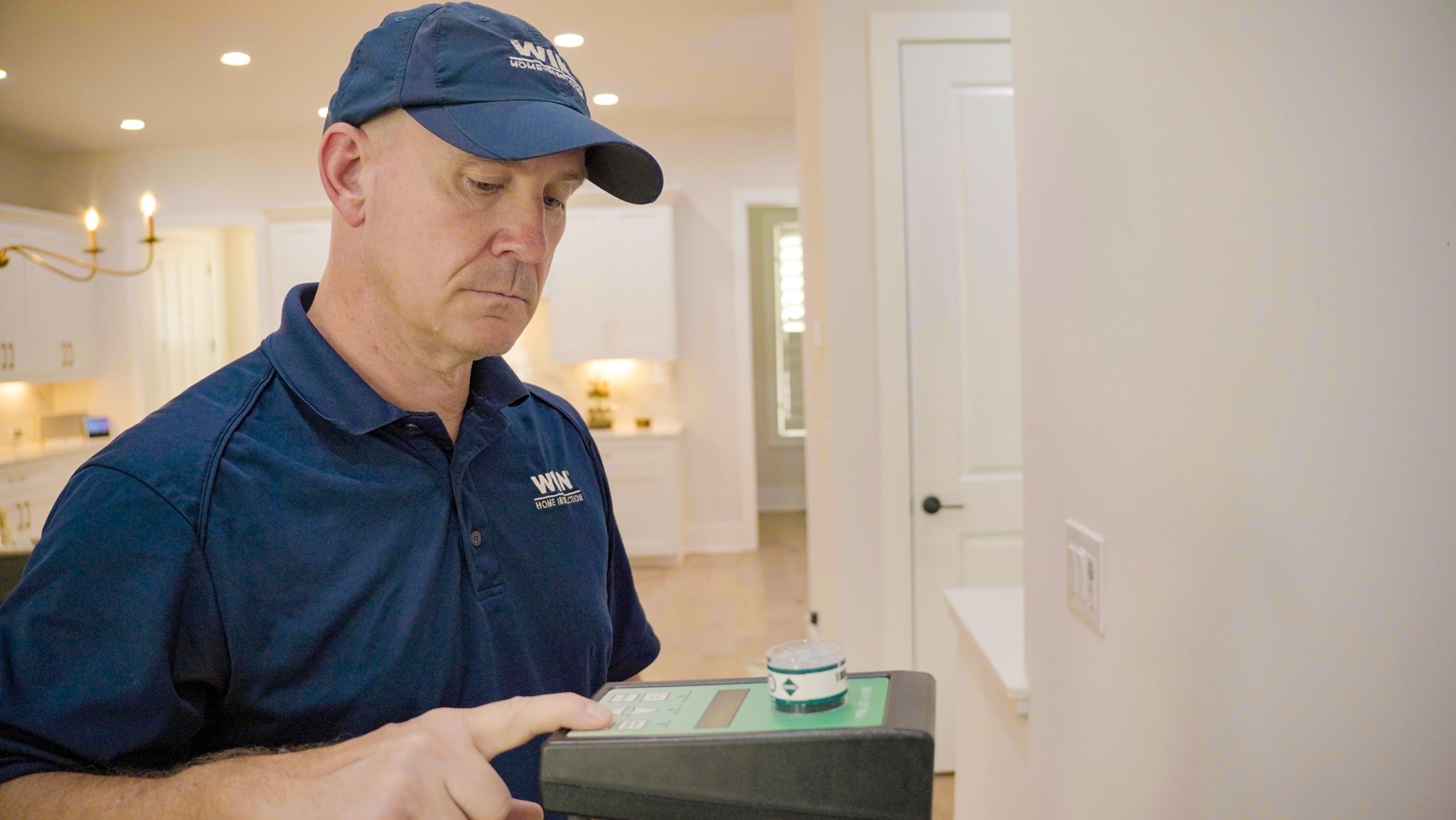 WIN Home Inspector doing a mold test in a house