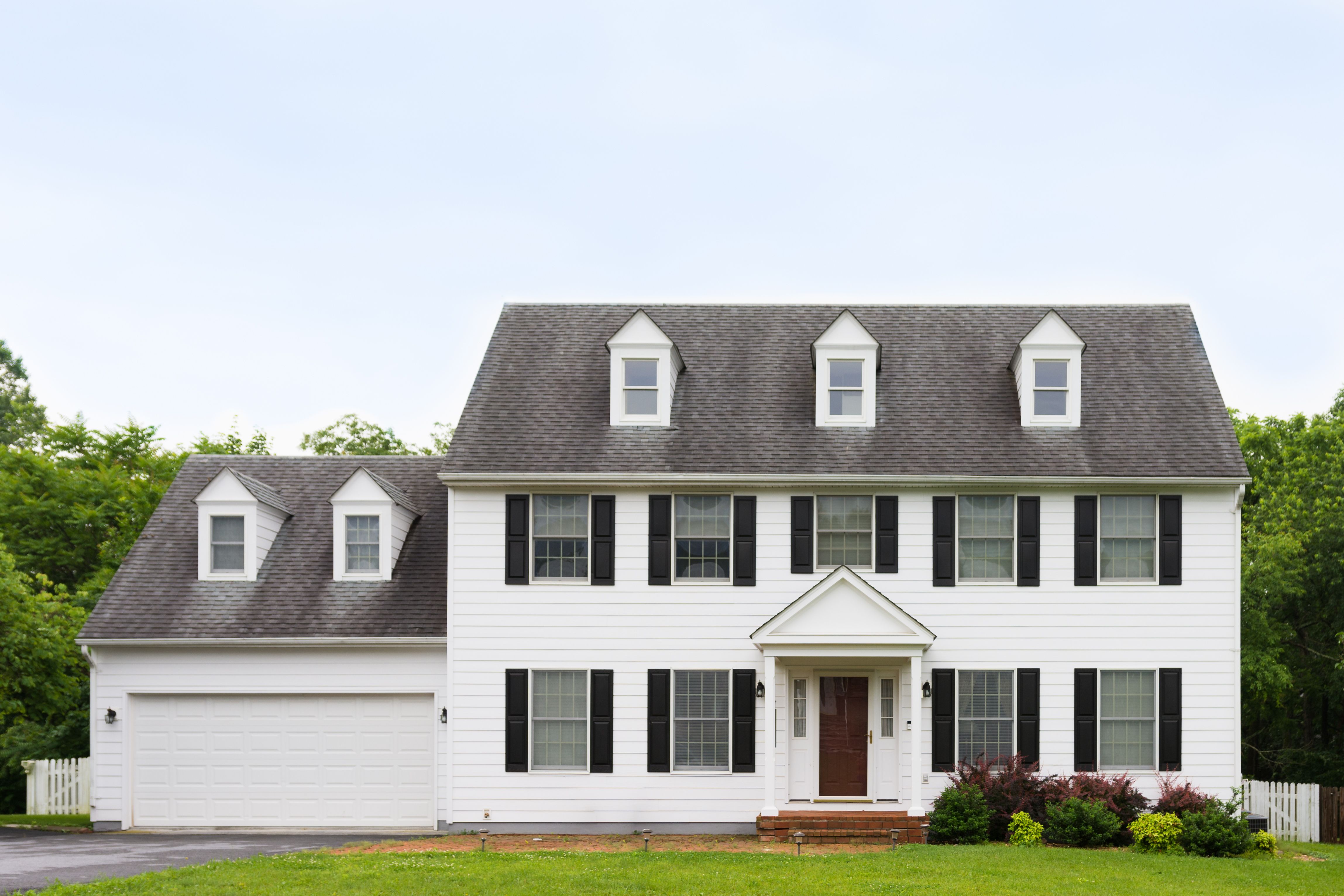 A beautiful house with a lawn and a walkway