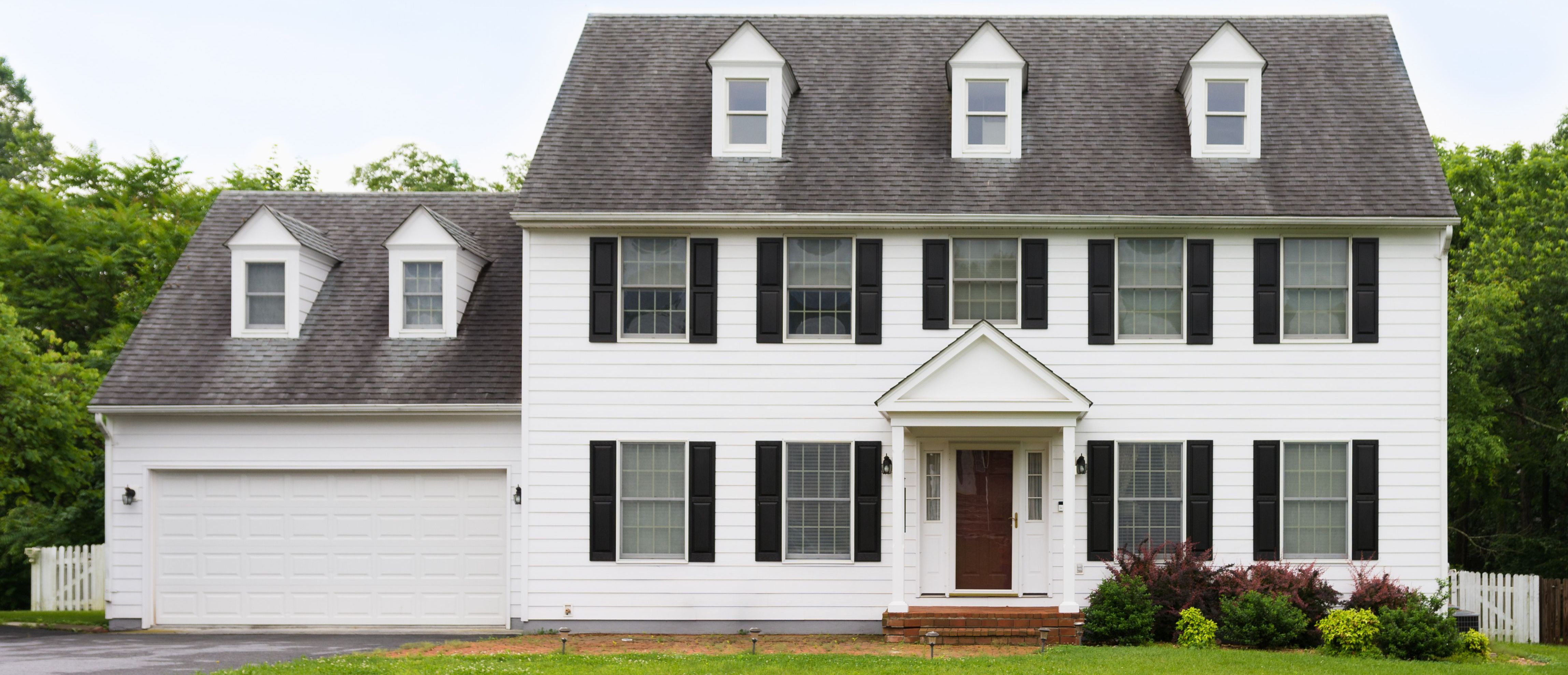 A beautiful house with a lawn and a walkway