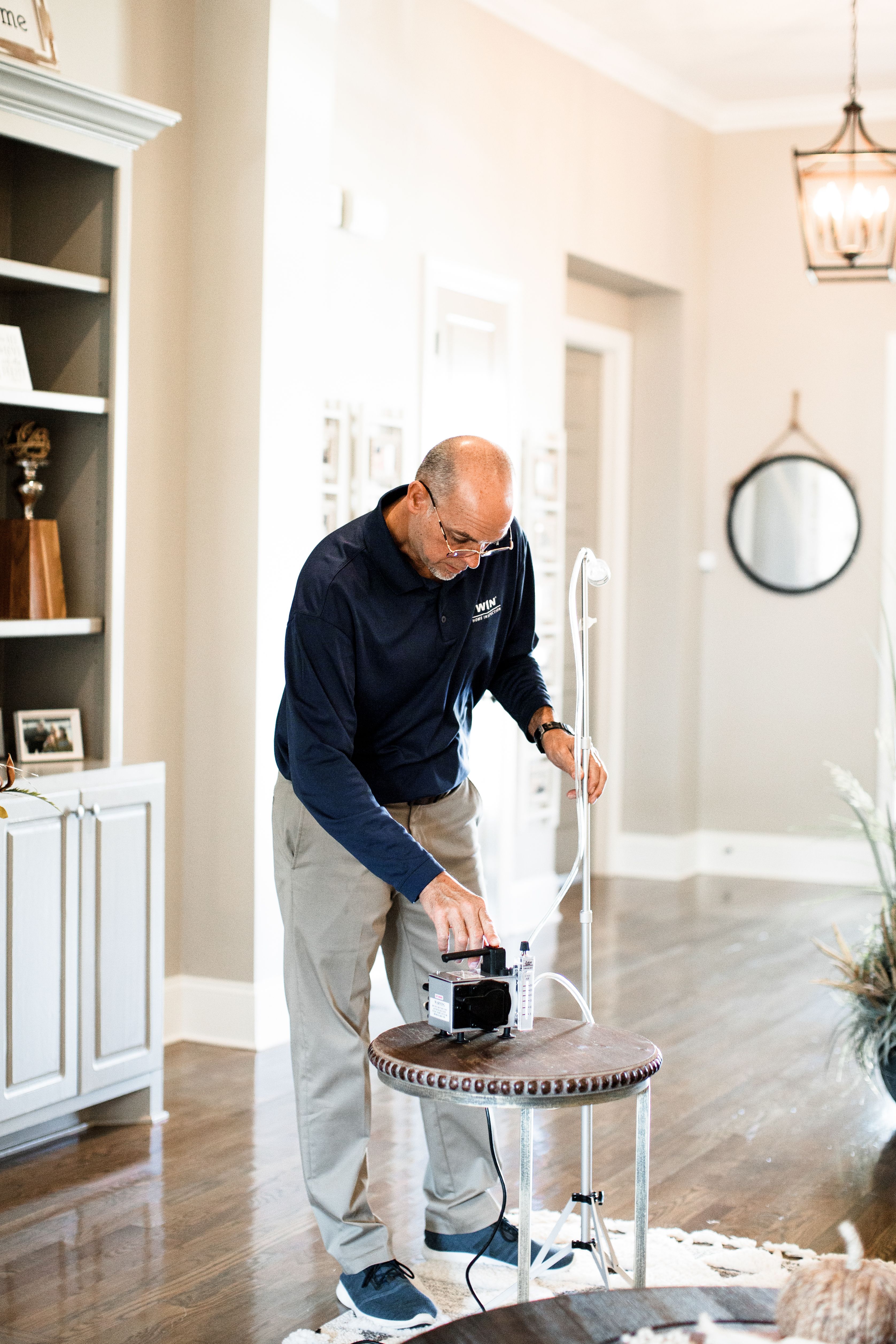 WIN Home Inspector checking the air quality of a house