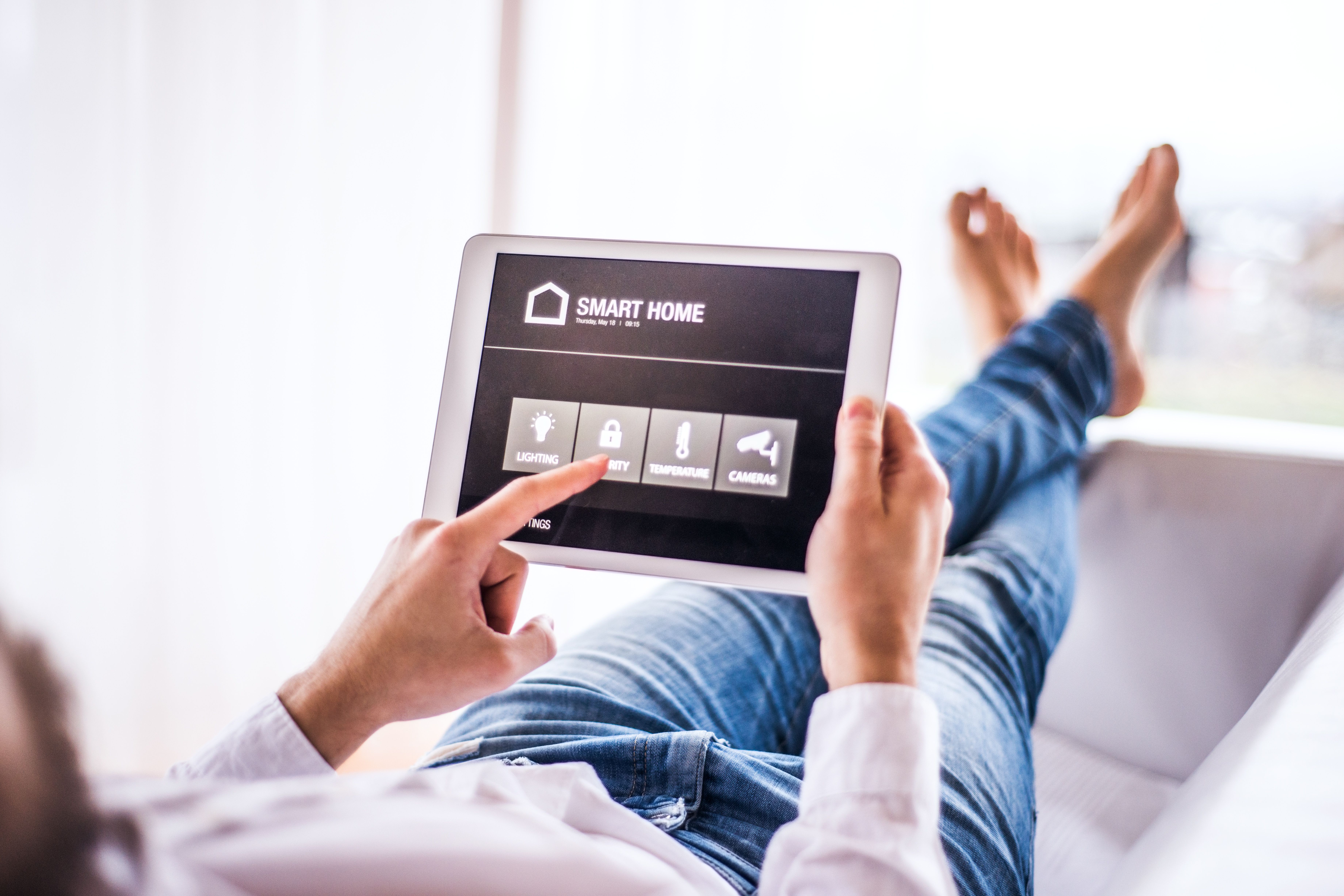 A person holding a tablet.