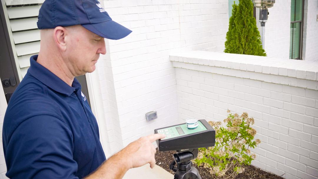 WIN Home Inspector checking the air quality of a house