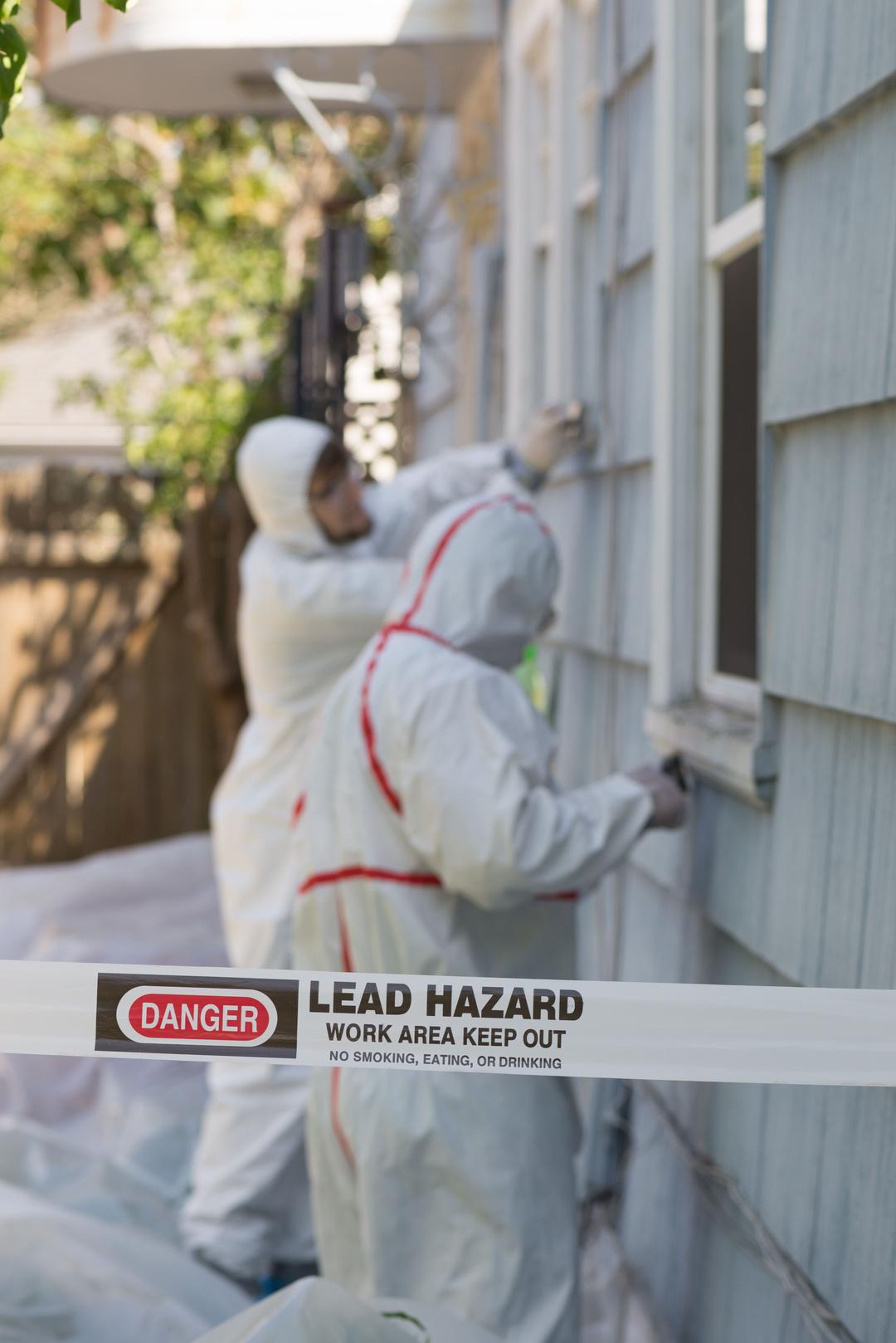 Two home inspectors performing lead test