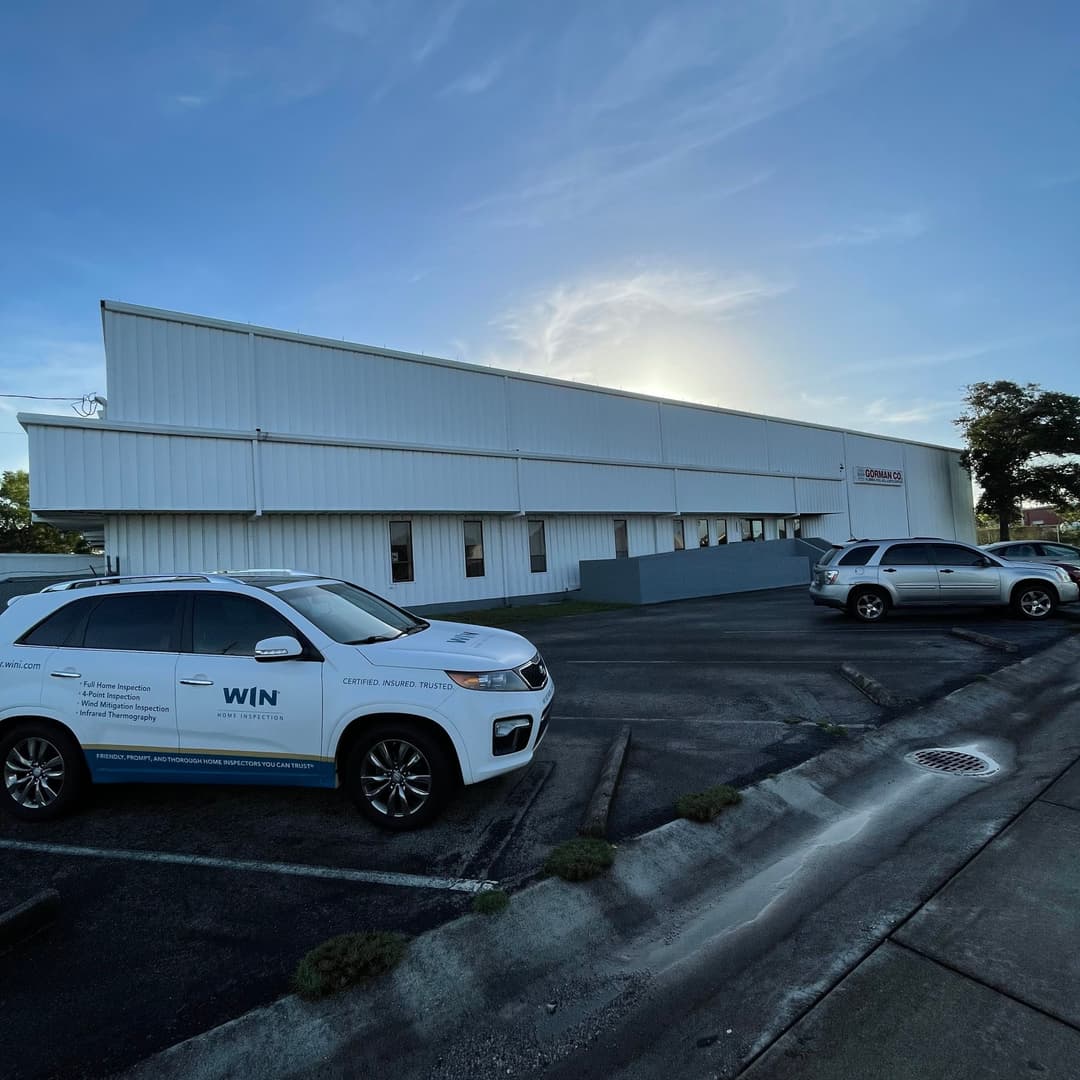 Commercial property area with WIN branded vehicle infront of it