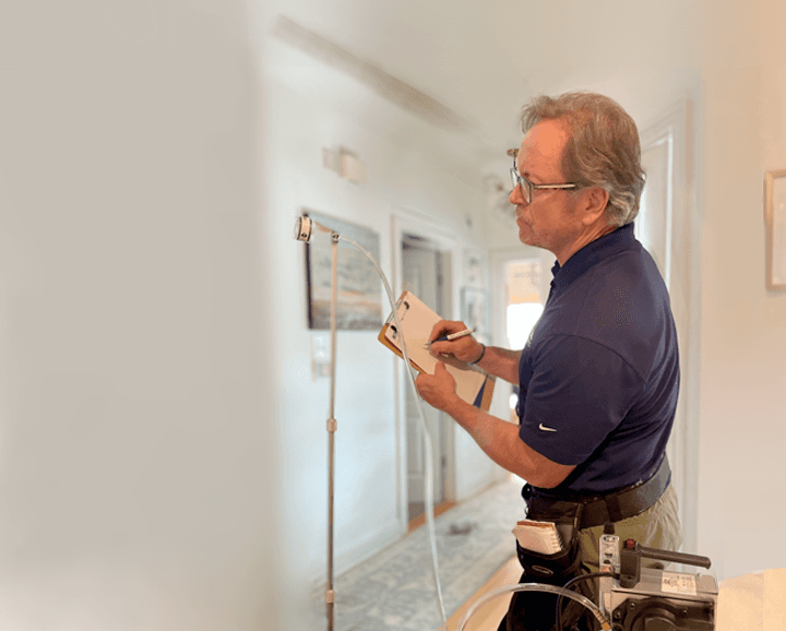 WIN Home Inspector doing a mold test in a house