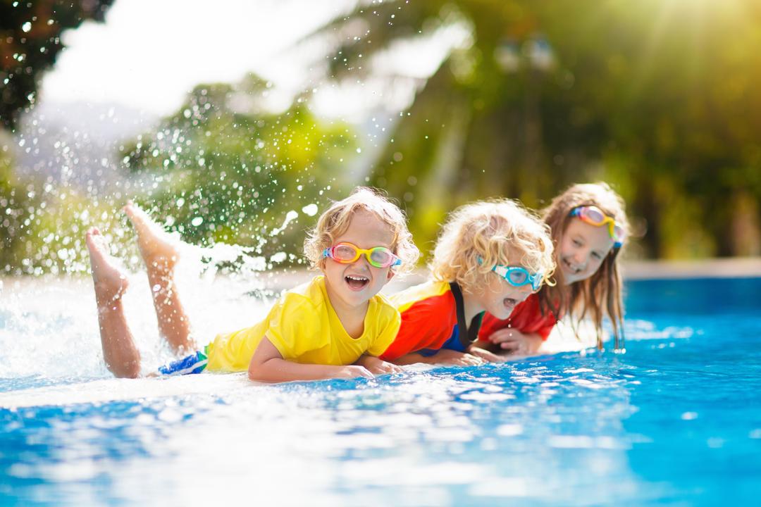 A group of children enjoying in the pool