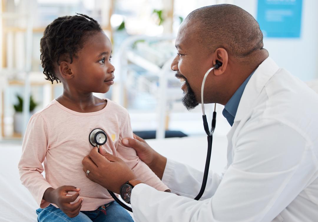 A doctor examining a child