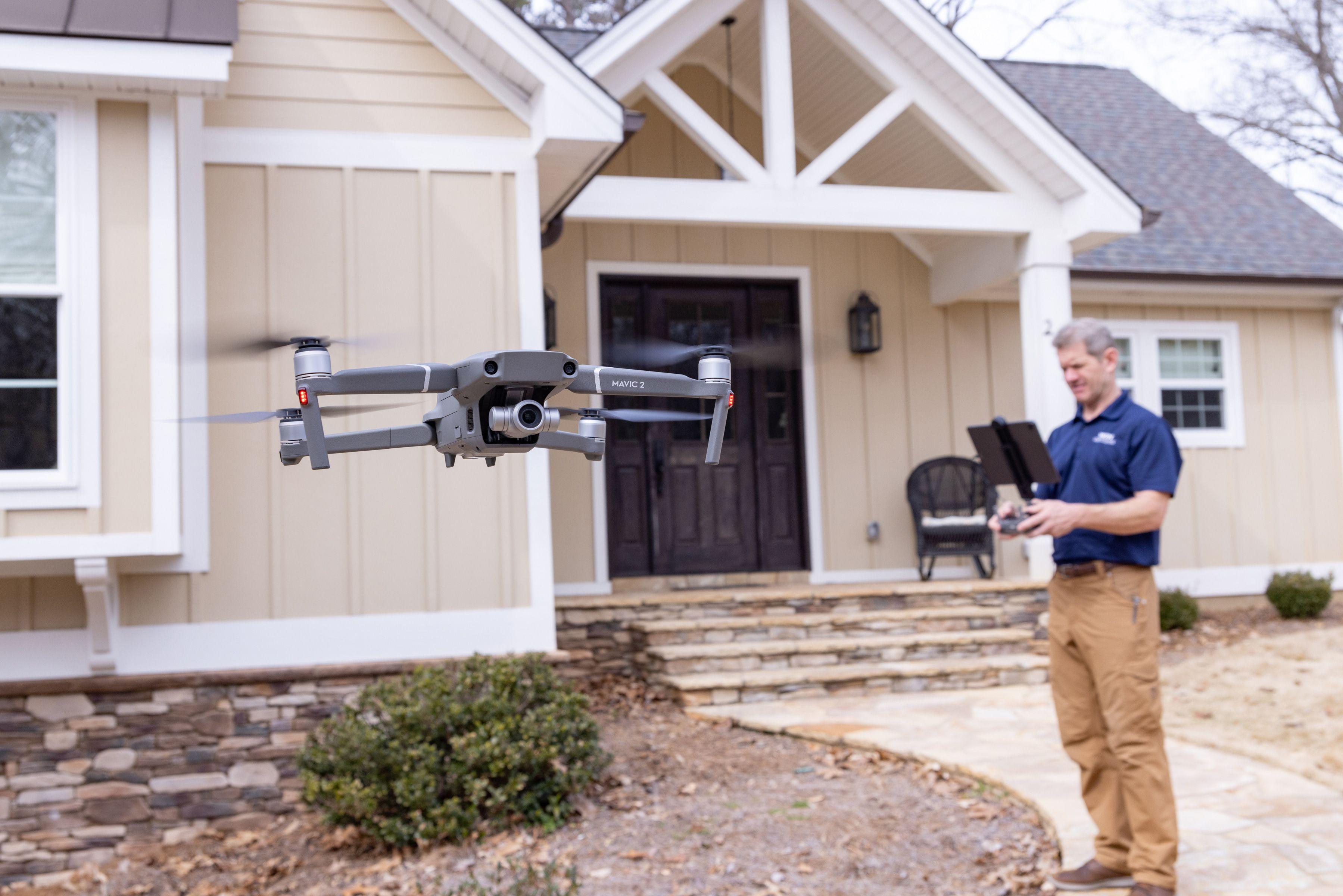 WIN Home Inspector using a drone for property inspection.