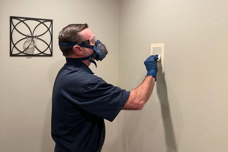 WIN Home Inspector doing a Lead Test wearing a mask and gloves