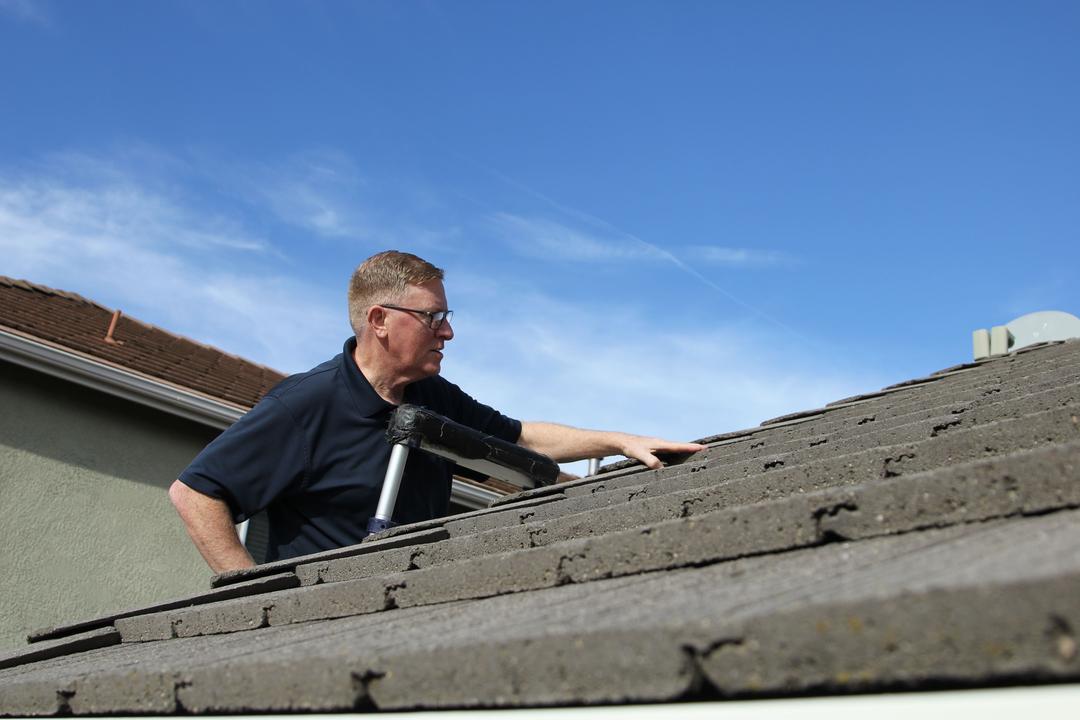 WIN Home Inspector doing a roof inspection