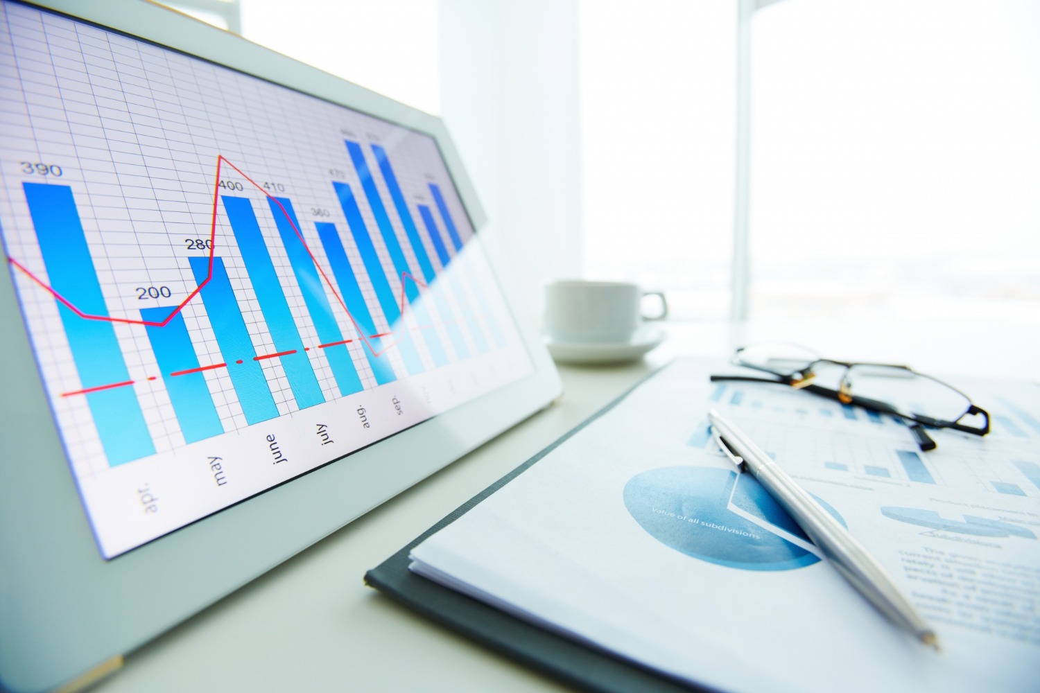 close up pen financial report with window background