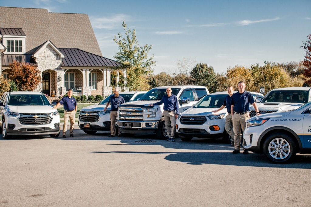 WIN Home Inspectors Posing with WIN Vehicles