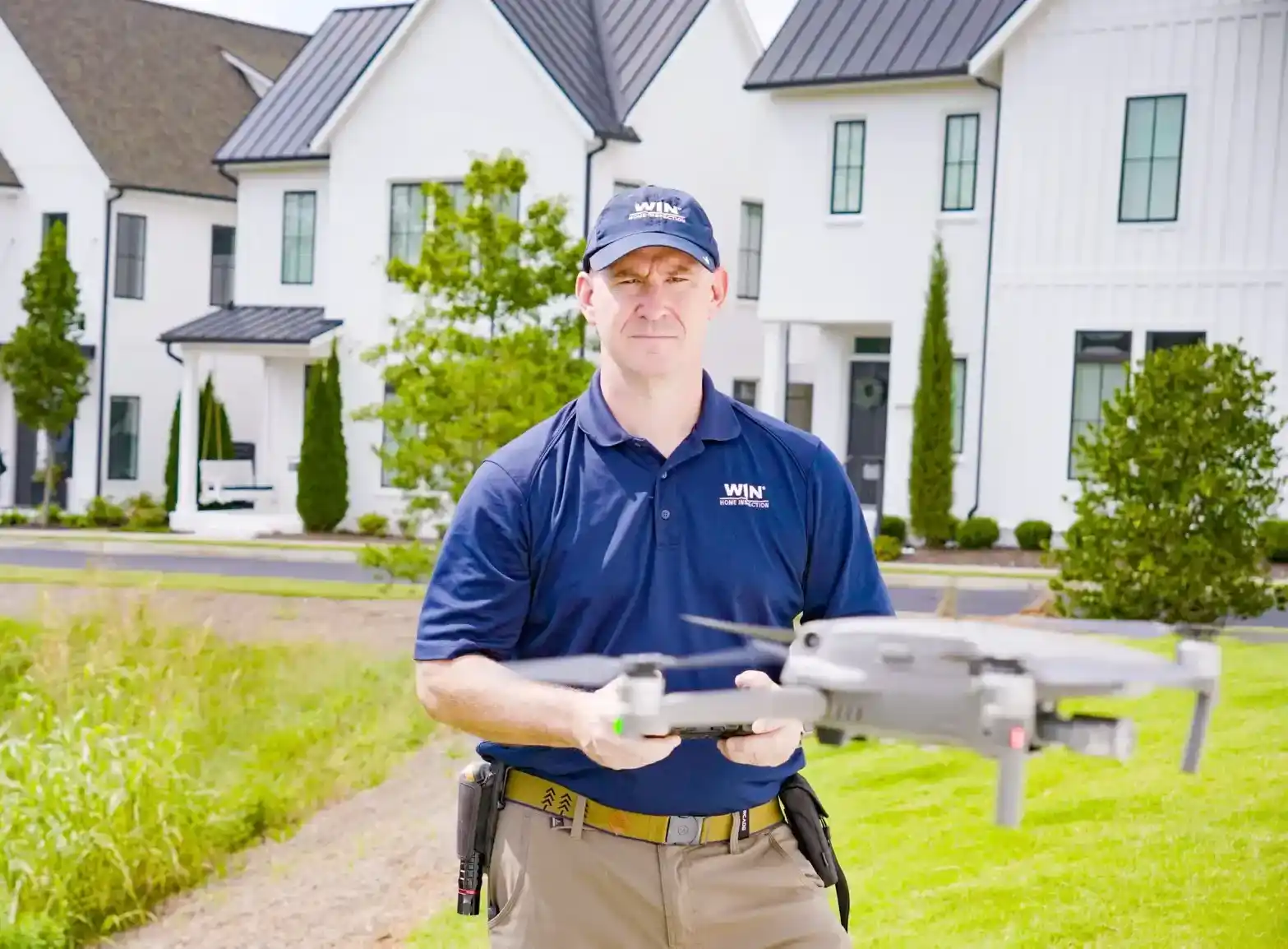 WIN Home Inspector flying a drone with focus