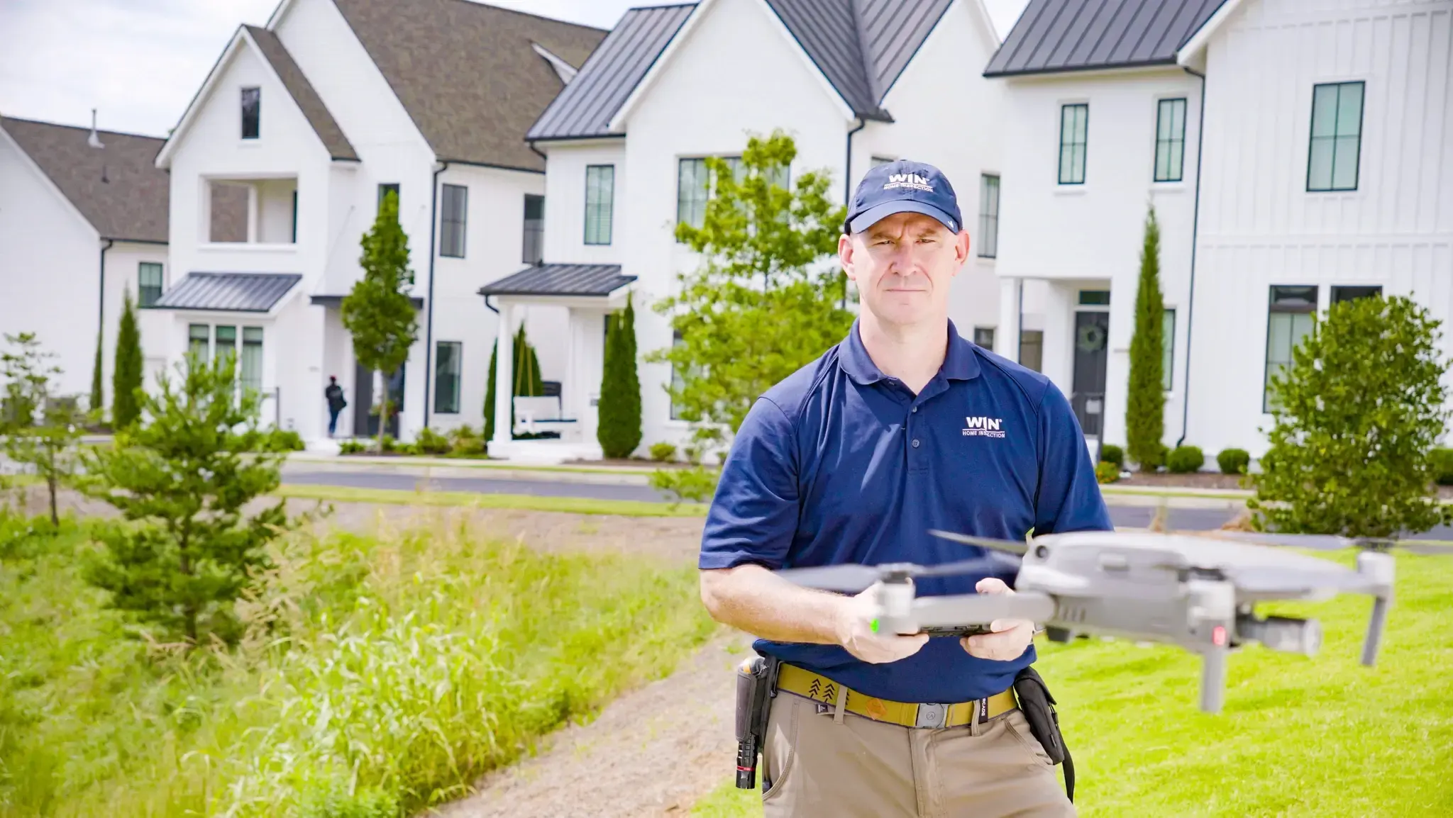WIN Home Inspector flying a drone with focus