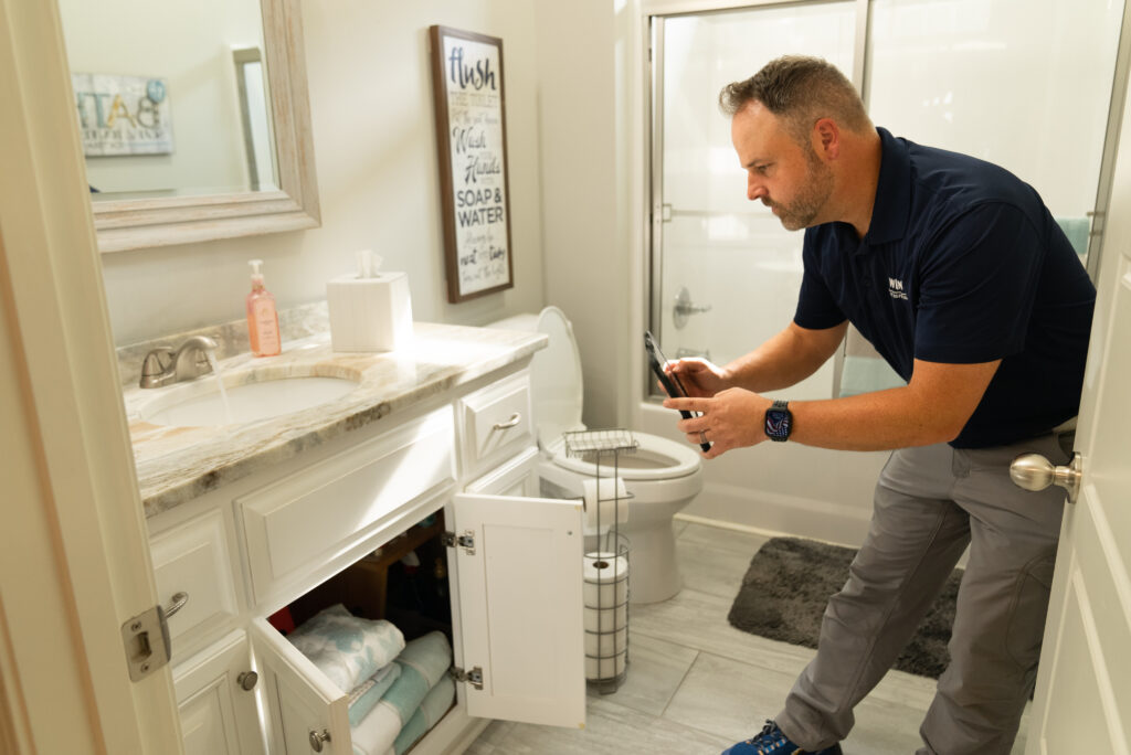 WIN Home Inspector inspecting bathroom